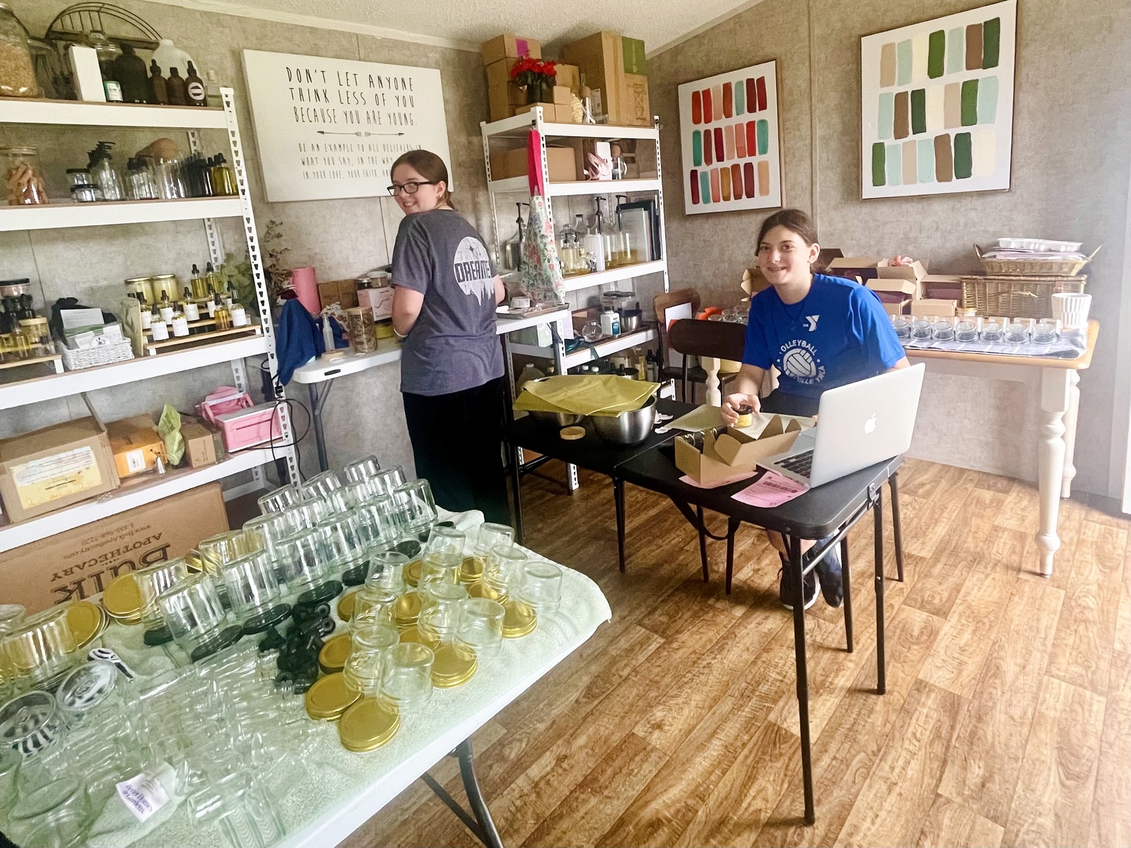 The Angelic & Co. workshop with shelves of products and participants working at tables